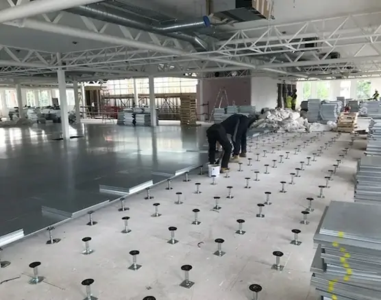 SFS project team consulting on a raised floor installation in the Gulf